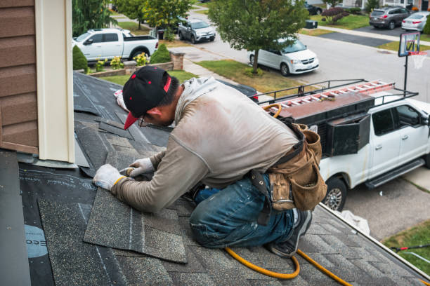 Professional Gutter Installation technician working in Medfield, MA